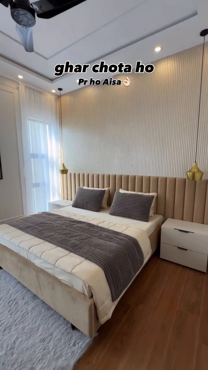 Luxury master bedroom suite with fluted accent wall and upholstered headboard by Avika Interior Patna