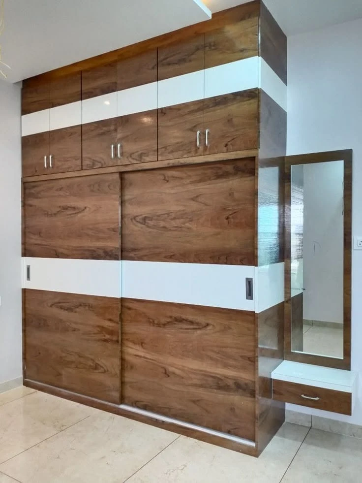Custom sliding wardrobe with integrated dresser and backlit mirror Patna