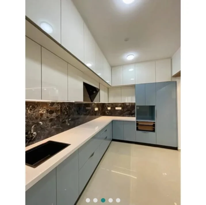 Contemporary glossy finish L-shaped modular kitchen with built-in appliances Patna