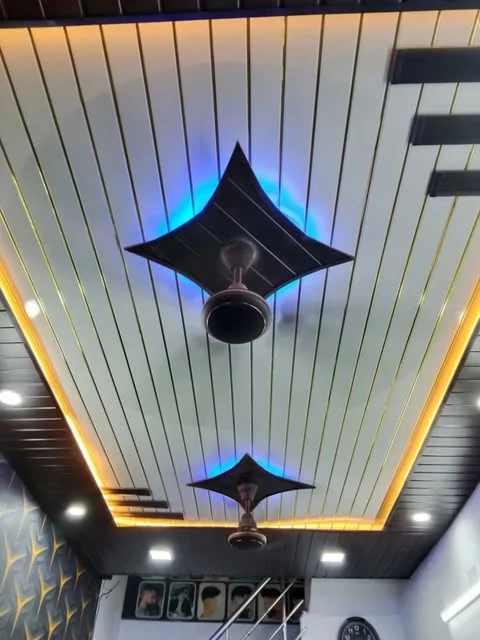 Dual fan blue cove false ceiling design with accent chandeliers Patna