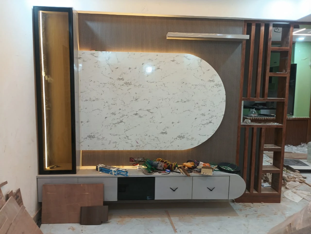 Fluted arched marble TV wall console with custom ambient backlight Patna