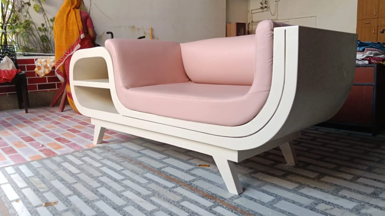 Designer curved luxury sofa and fluted paneling in living room by Avika Interior Patna